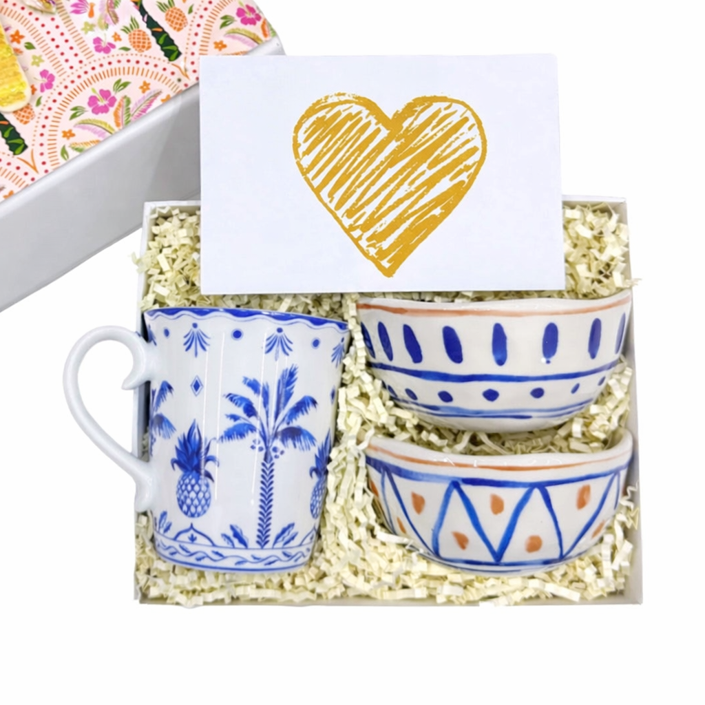 Set of ceramic mugs with decorative patterns in a gift box with a heart card.