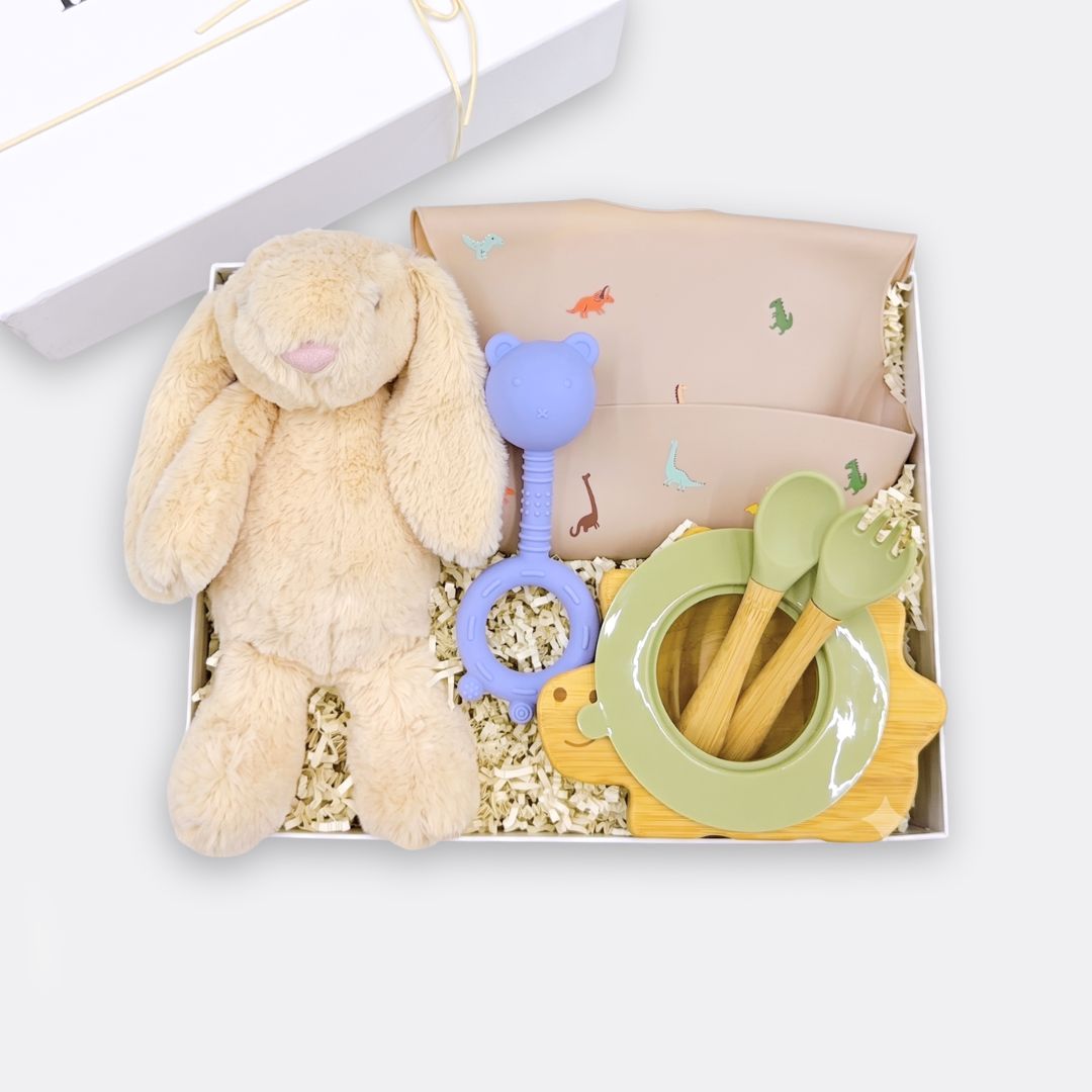 Floppy Ear Bunny Toy, Dino Food Catcher Silicone Bib, Green Dino Wooden & Silicone Bowl + Fork & Spoon, Teddy Hand Grip Teether Rattle, the best customized gift and gifts for her and for him from Inna Carton online shop Dubai, UAE!
