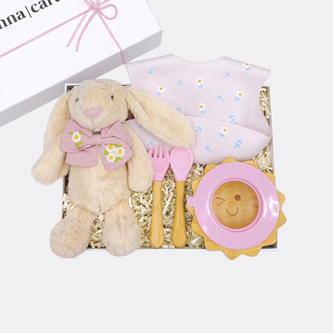 Floppy Ear Bunny Toy, Daisy Food Catcher Silicone Bib, Pink Sun Wooden & Silicone Bowl + Fork & Spoon, Daisy Embroidered Linen Bow Clip, the best customized gift and gifts for her and for him from Inna Carton online shop Dubai, UAE!
