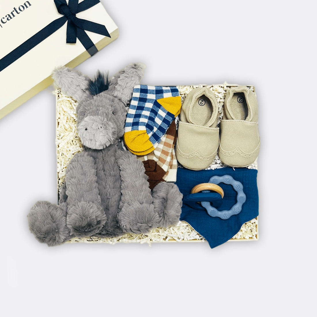 Fufflewuddle Donkey Soft Toy My Moccasin | Off white Double-sided cotton bib Whale Teether Baby Carreaux Socks | Blue Baby Carreaux Socks | Tan, the best-customized gift box and gifts for her and for him from Inna Carton online shop Dubai, UAE