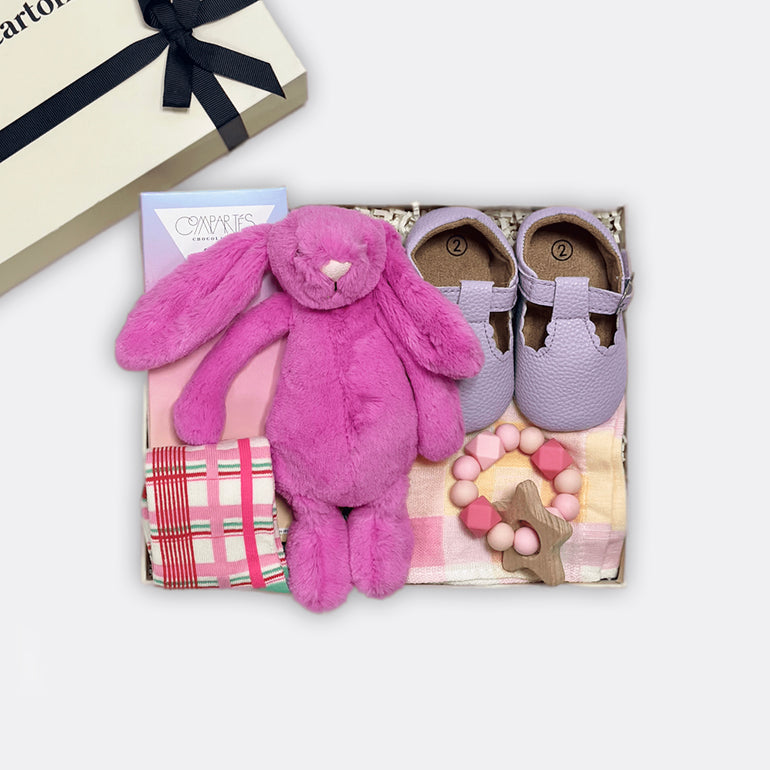 Bashful Bunny Soft Toy | Rose Cookie Butter Milk Chocolate Cookie Bar Baby T Shoes | Lavender (suitable from 6-12months) Checkered Muslin Square | Pink Star Teether Baby Happy Socks, the best-customized gift box and gifts for her and for him from Inna Carton online shop Dubai, UAE