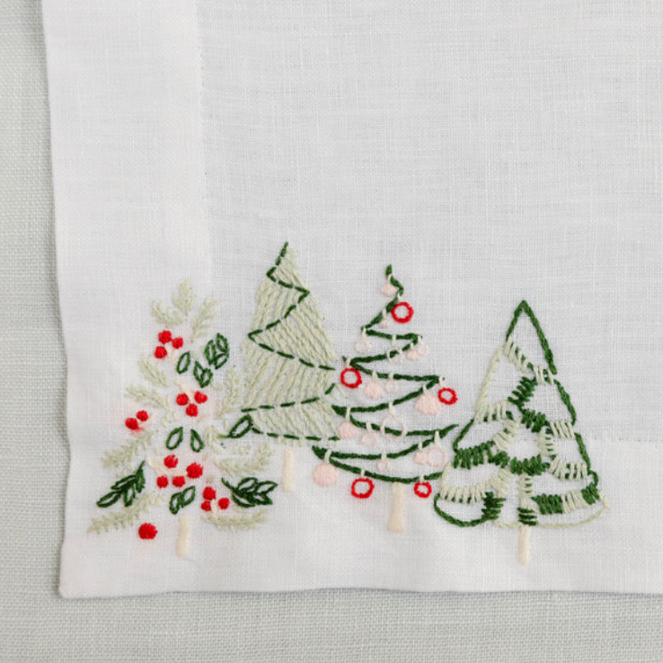 Embroidered towel with Christmas tree design on a white background